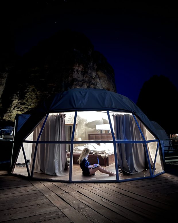 A glowing dome at night in the Jordan desert