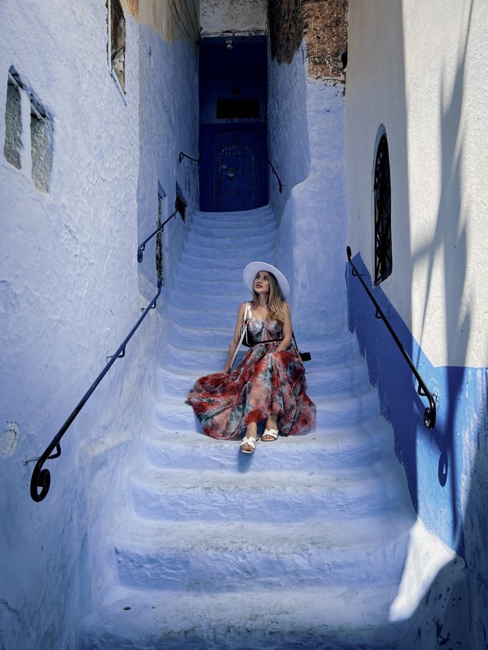Angelika on the blue stairs in Chefchaouen